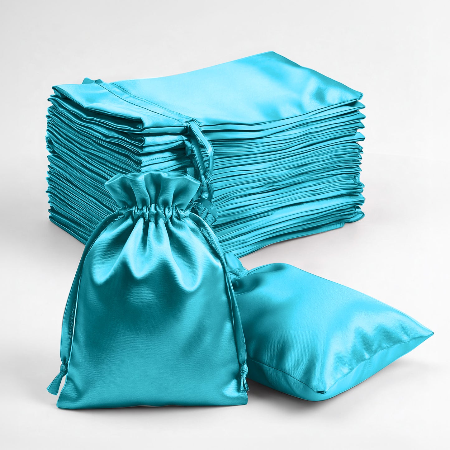 Turquoise satin drawstring favor bags for jewelry and candy gifts.