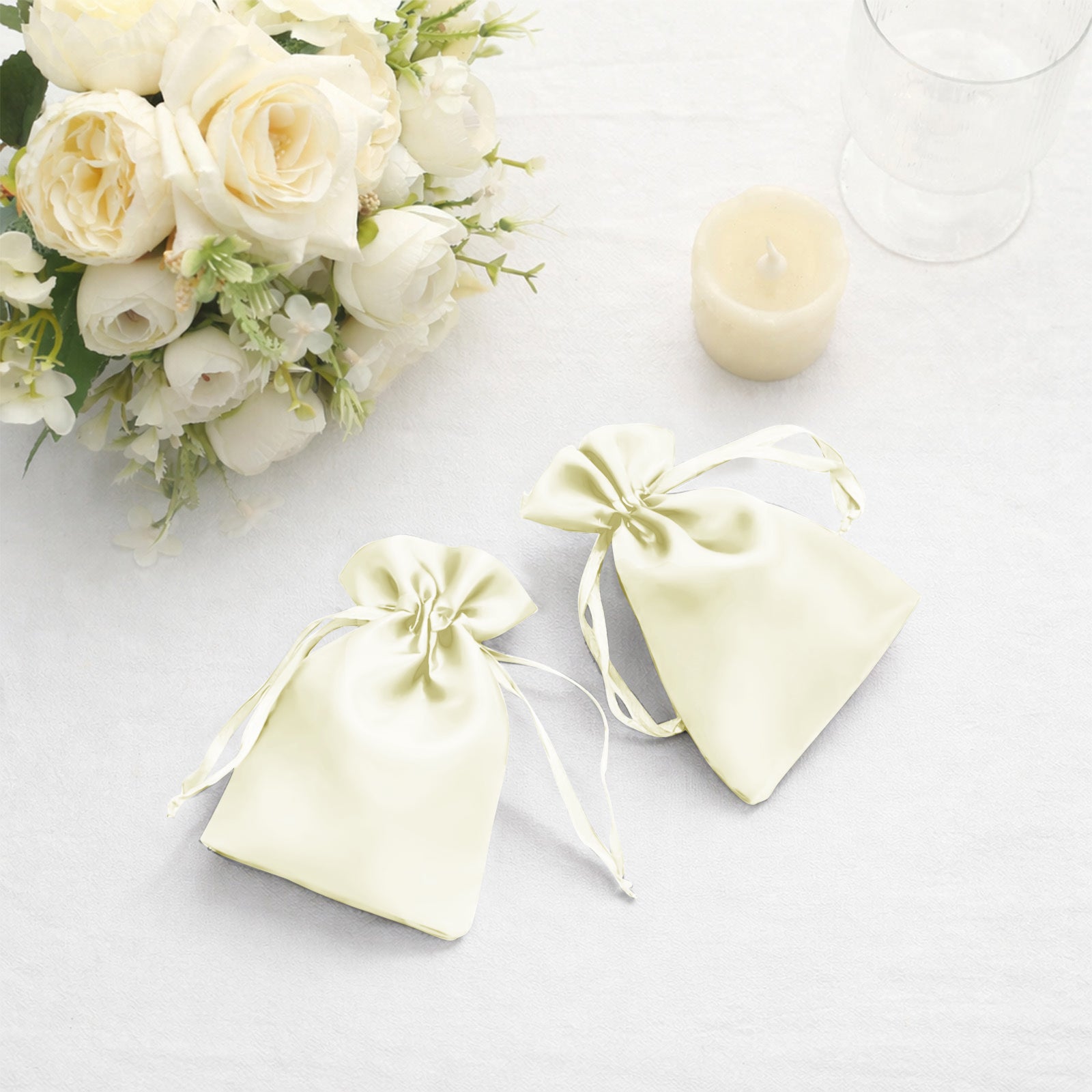Yellow satin drawstring favor bags for weddings and parties.