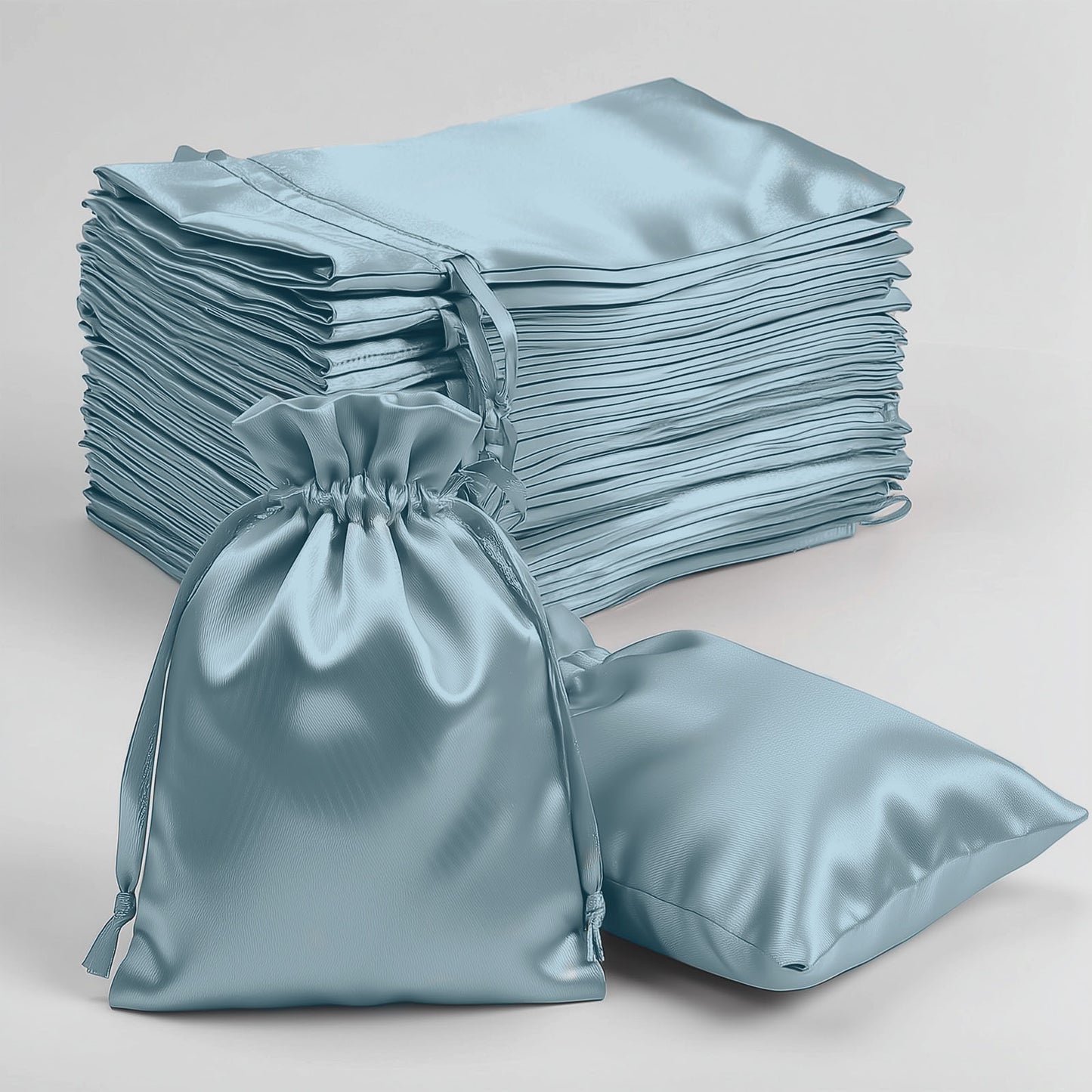 Dusty blue satin drawstring bags for weddings and parties, 60 pack.