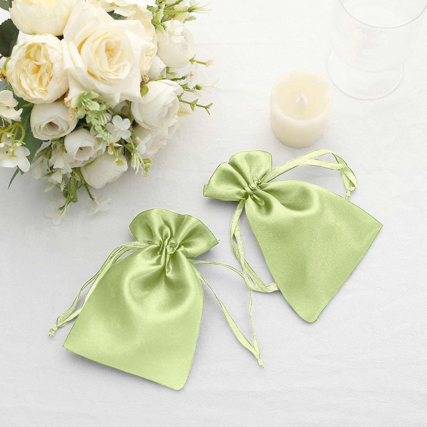 Apple green satin drawstring bags for wedding favors.