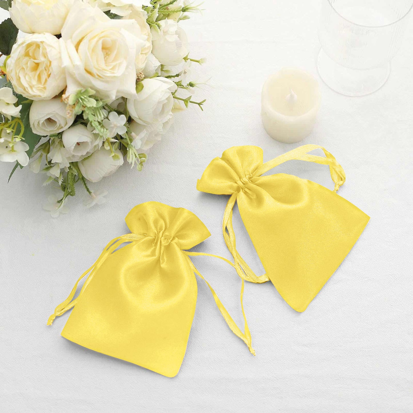 Gold satin drawstring pouches for wedding favors, set of 60.