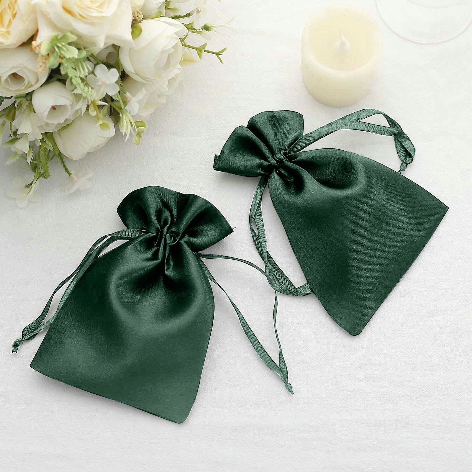 Hunter emerald green satin drawstring pouches for wedding favors.