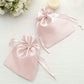 Blush satin drawstring bags for wedding party favors.