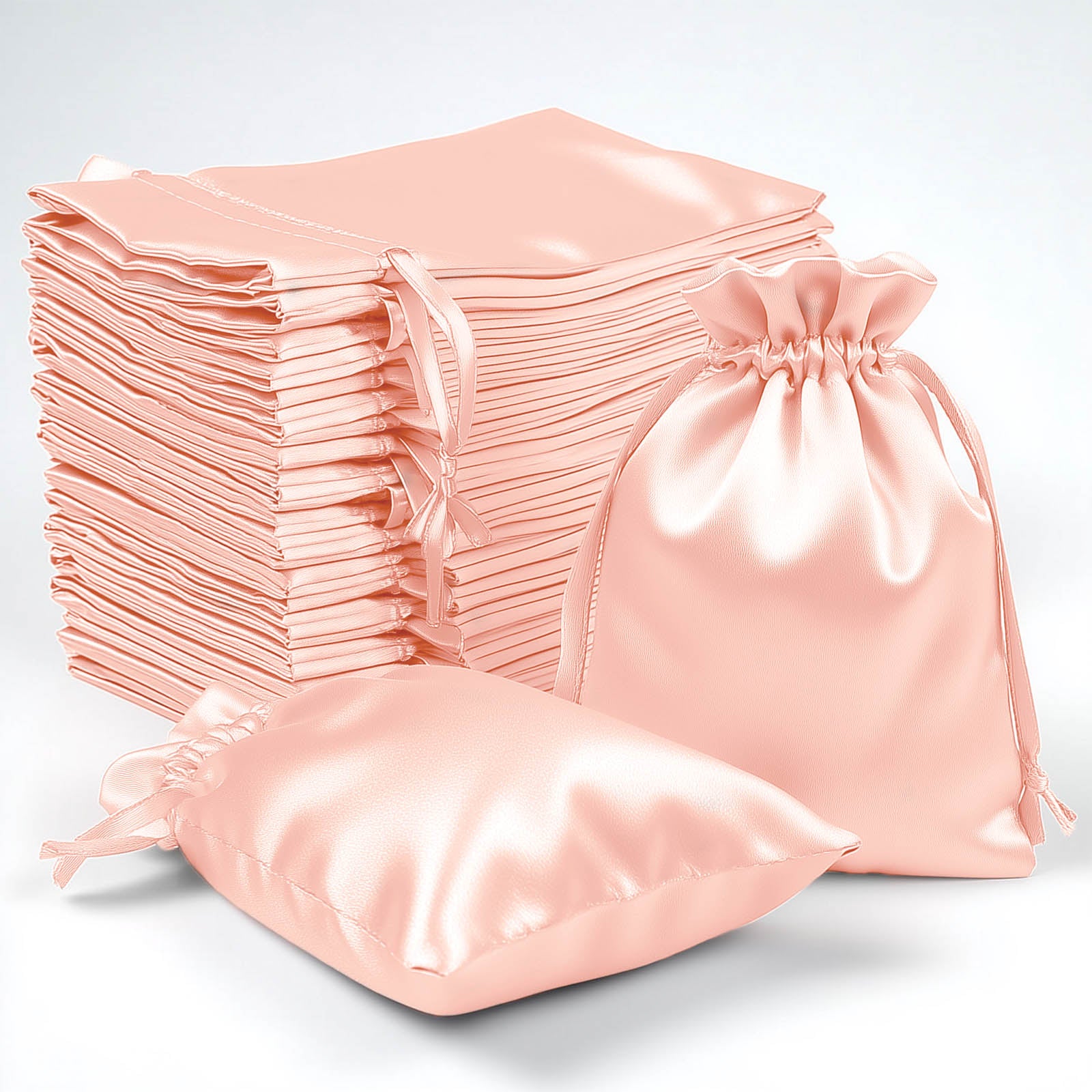 Dusty rose satin drawstring gift bags, perfect for weddings and parties.