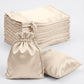 Beige satin drawstring gift bags for weddings and parties, 60 pack.