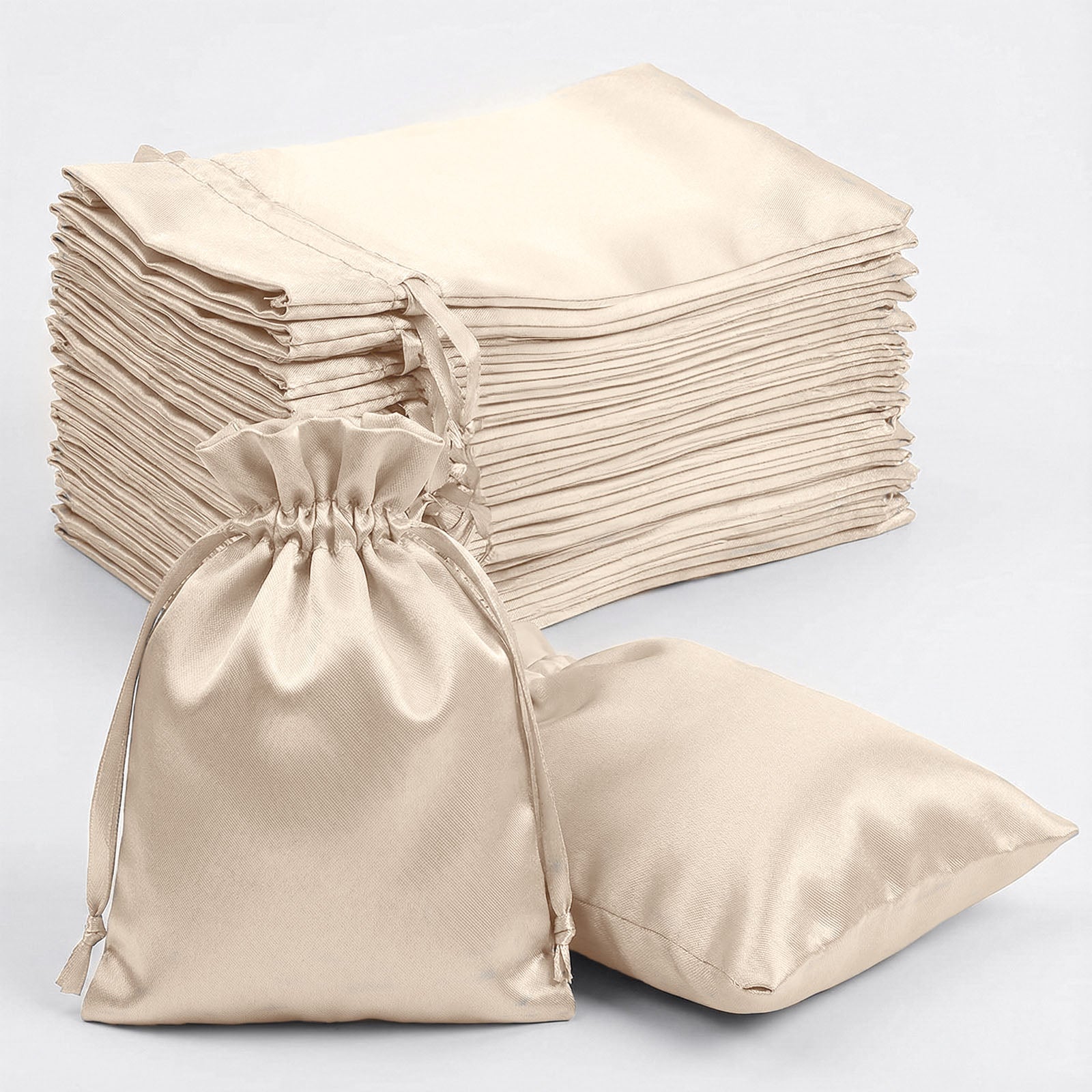 Beige satin drawstring gift bags for weddings and parties, 60 pack.