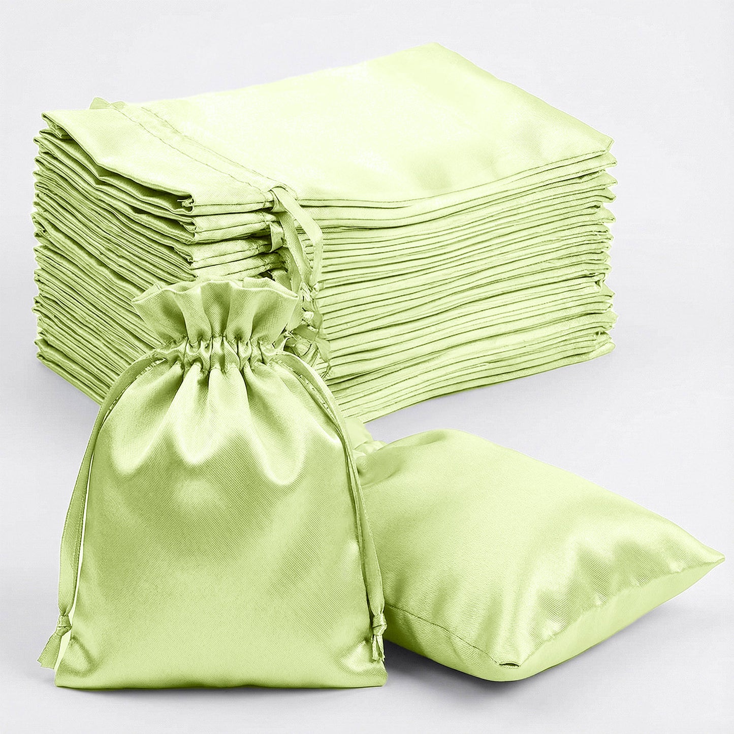 Apple green satin drawstring gift bags, 60 pack, perfect for weddings and parties.