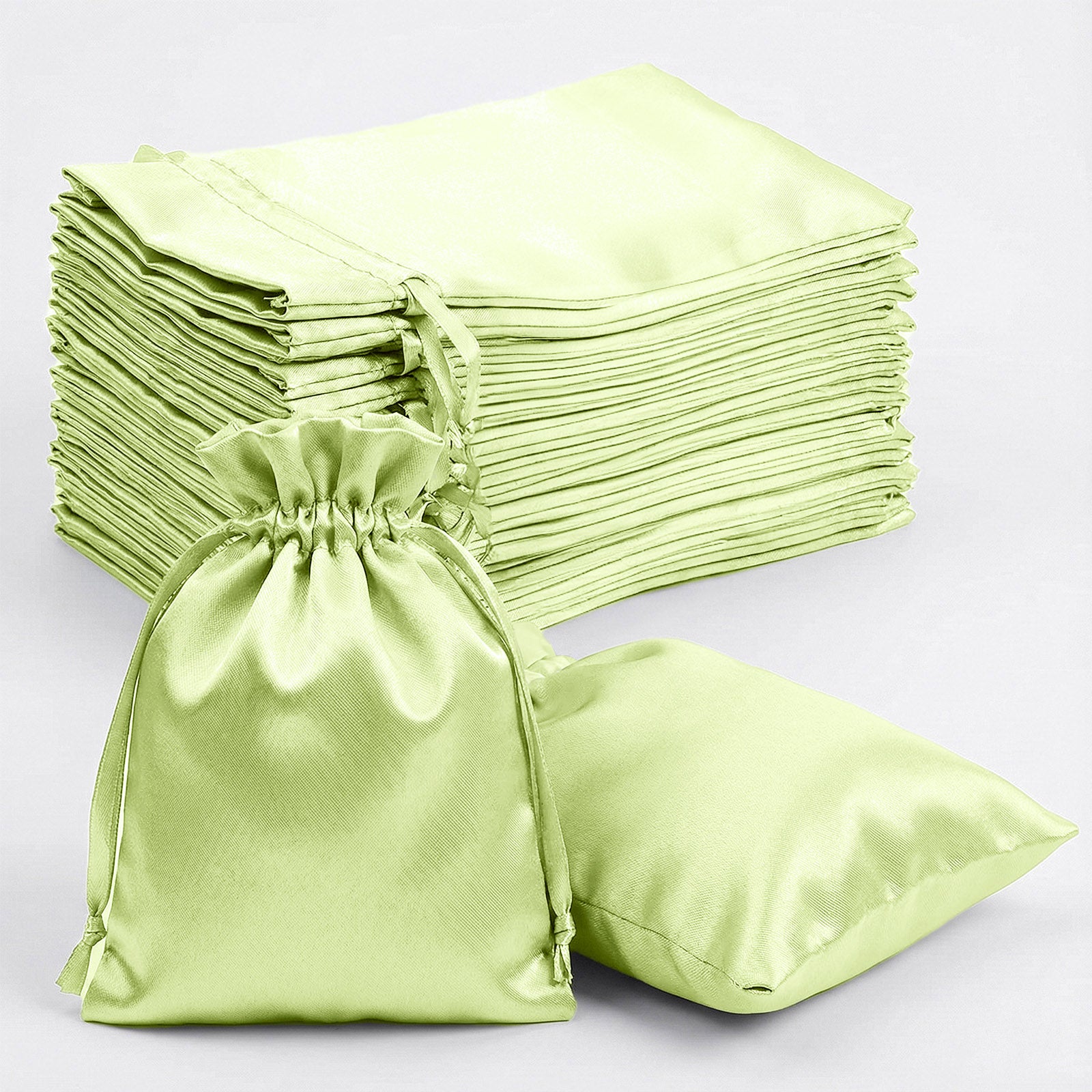 Apple green satin drawstring gift bags, 60 pack, perfect for weddings and parties.