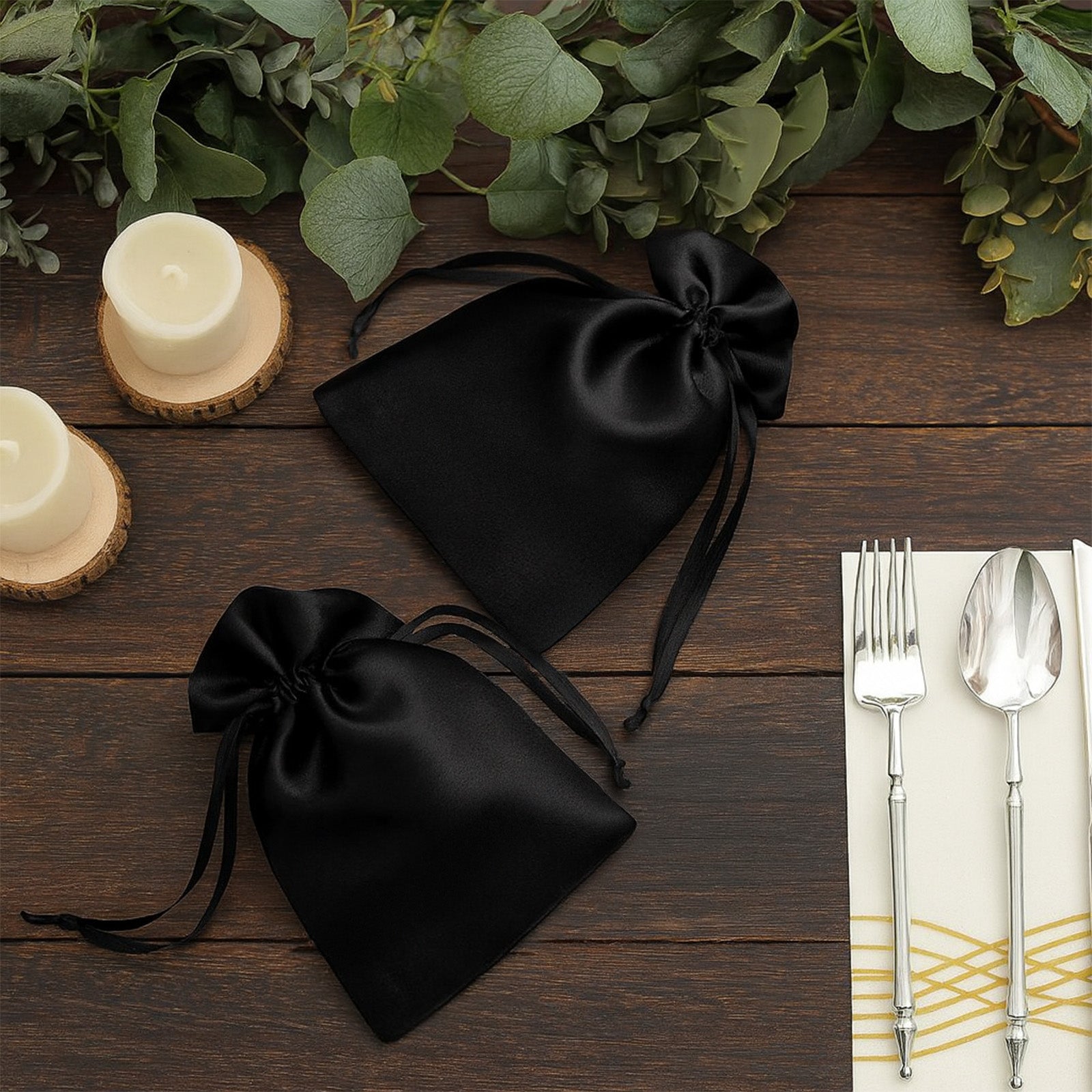 Black satin drawstring gift bags for weddings and parties.