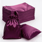 Eggplant satin drawstring gift bags for weddings and parties.