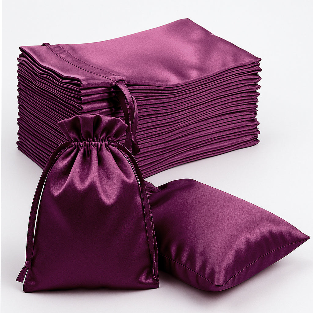 Eggplant satin drawstring gift bags for weddings and parties.
