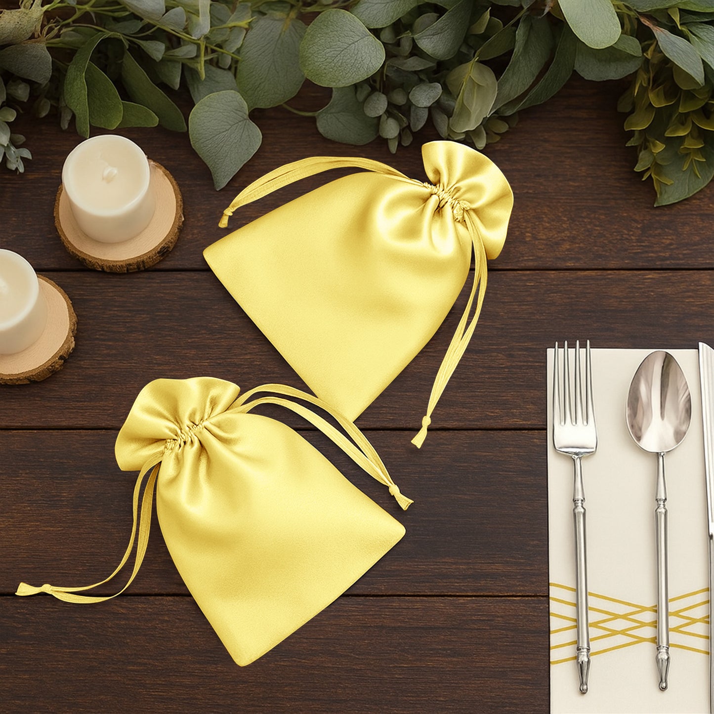 Yellow satin drawstring bags for wedding party favors.