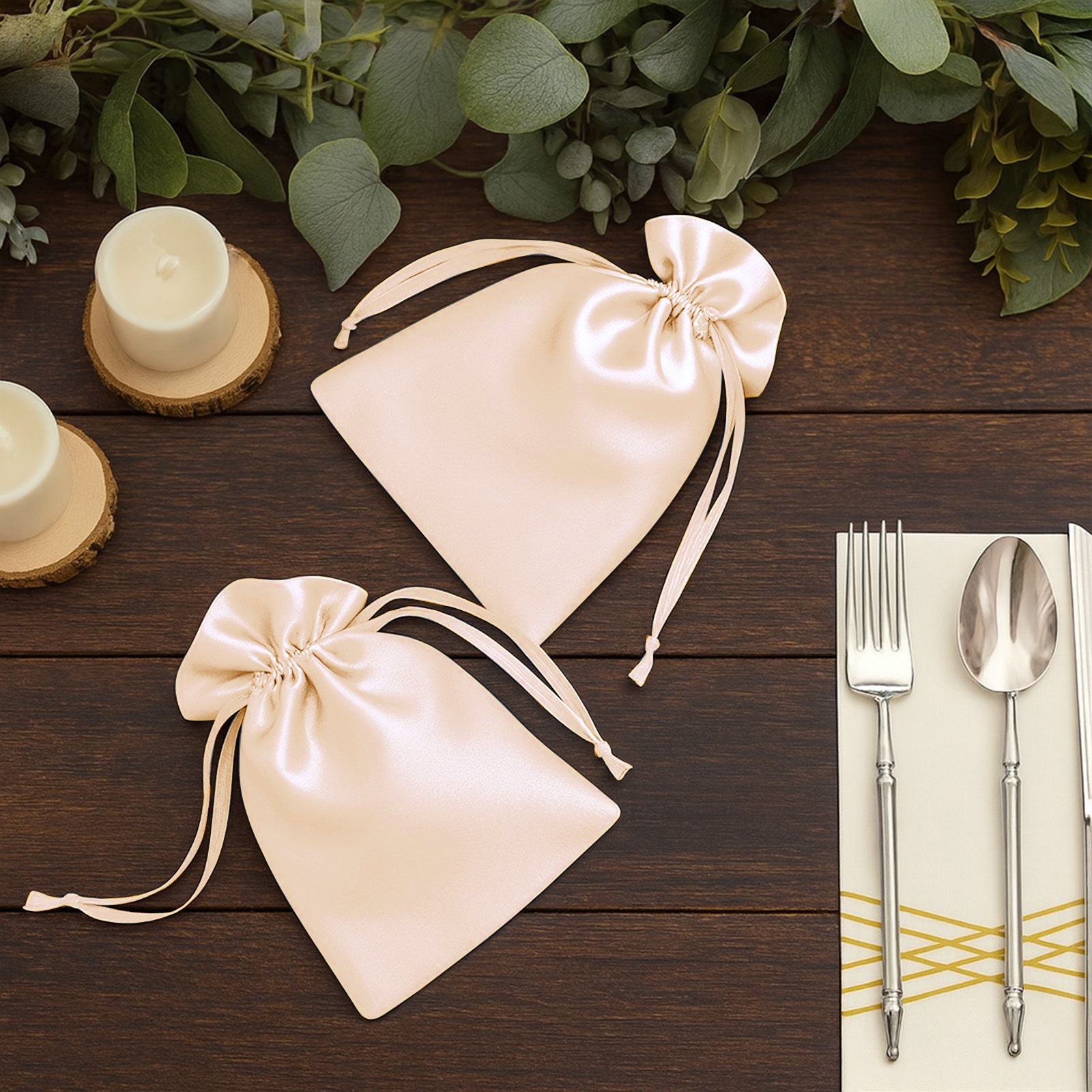 Peach satin drawstring gift bags for wedding party favors.