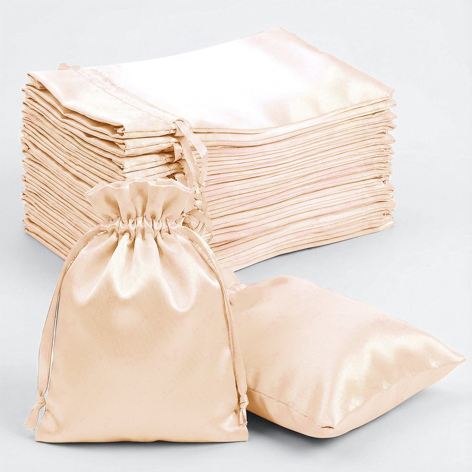 Peach satin drawstring gift bags in a 60 pack.