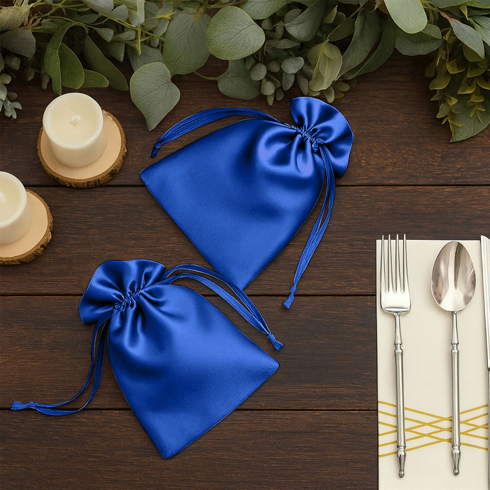 Royal blue satin drawstring bags for wedding party favors.