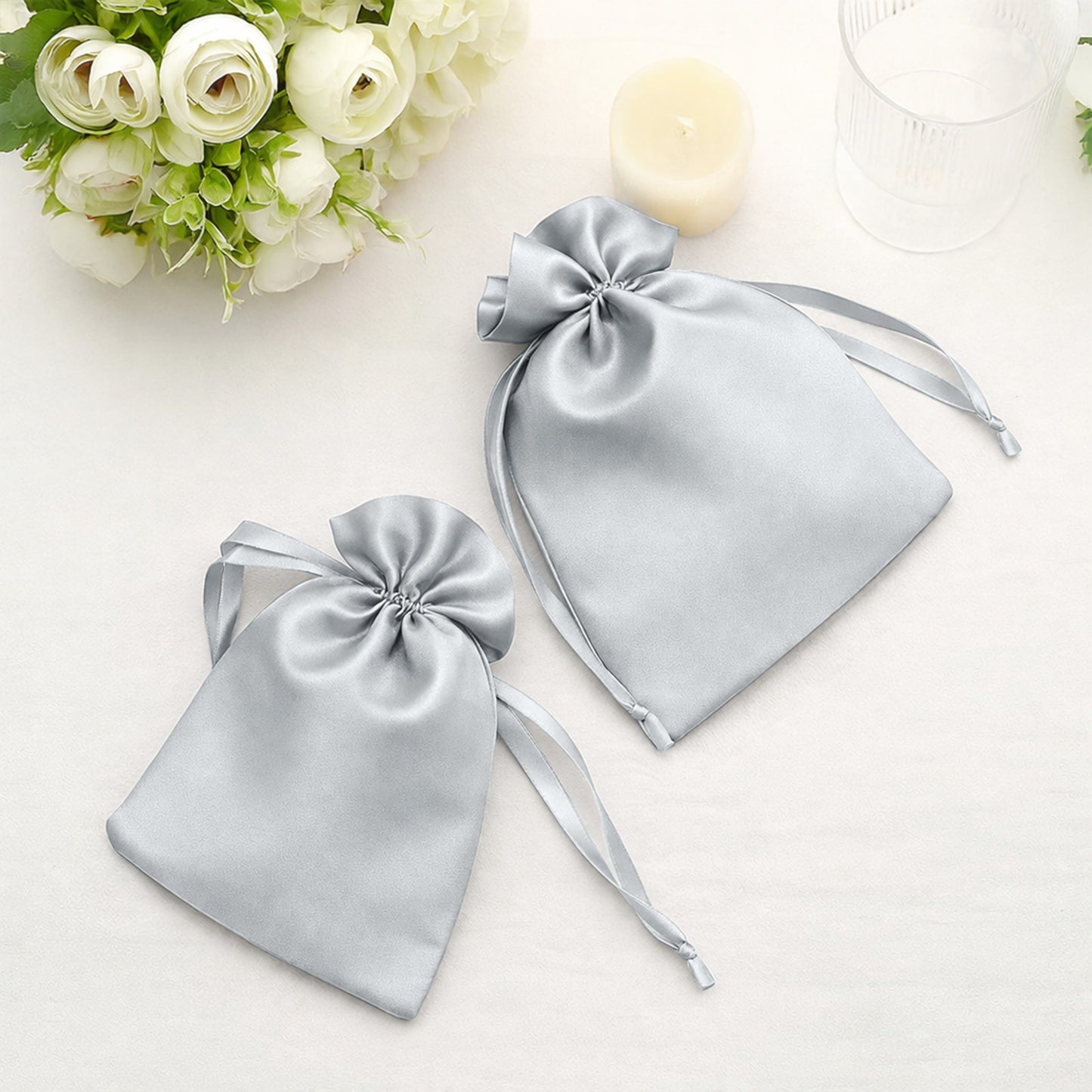 Silver satin drawstring bags for wedding party favors. Pack of 60.
