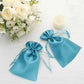 Turquoise satin drawstring gift bags for weddings and parties.