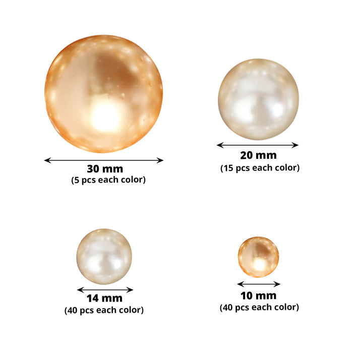 Assorted off white and gold faux pearl beads for DIY crafts.