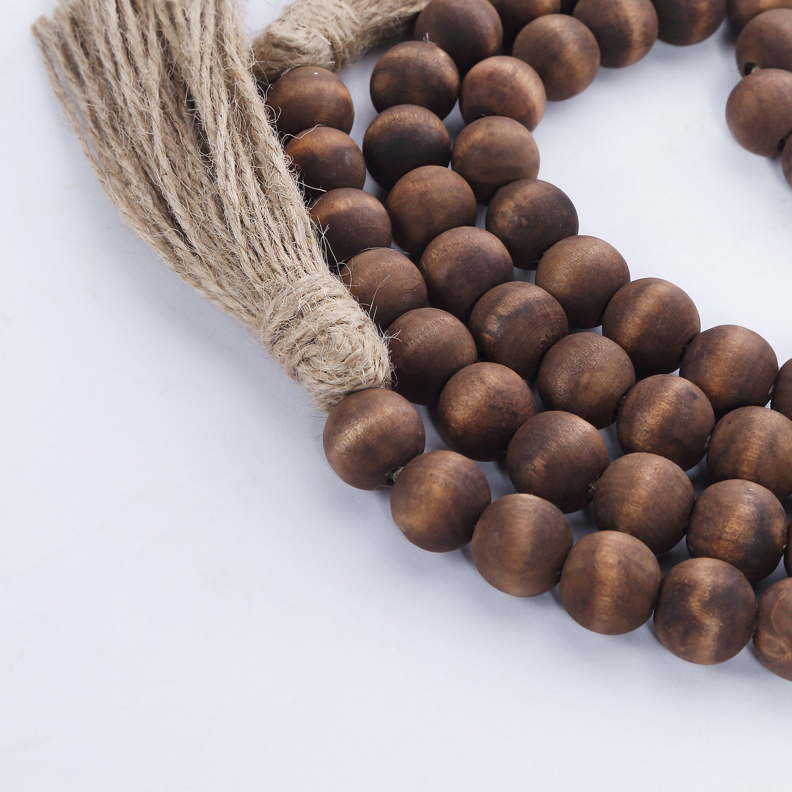 Brown rustic boho chic wood bead garland with tassels.
