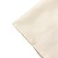 Beige chiffon polyester curtain drapes with rod pockets for events.