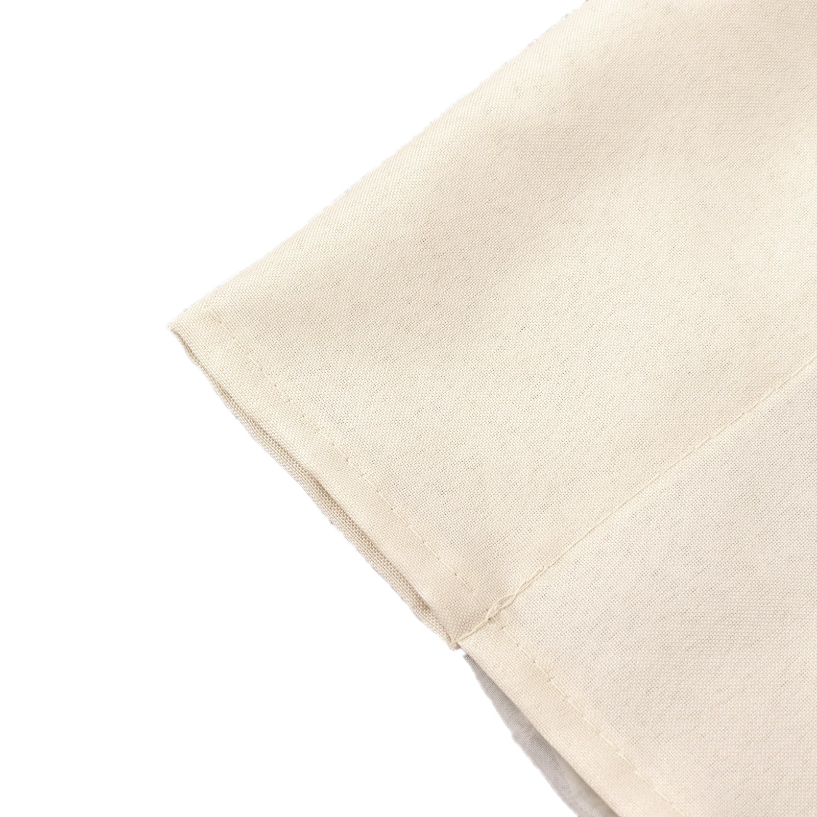 Beige chiffon polyester curtain drapes with rod pockets for events.