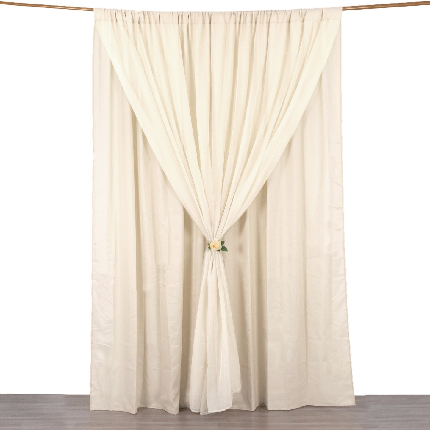 Beige chiffon polyester event curtain drapes with rod pockets.