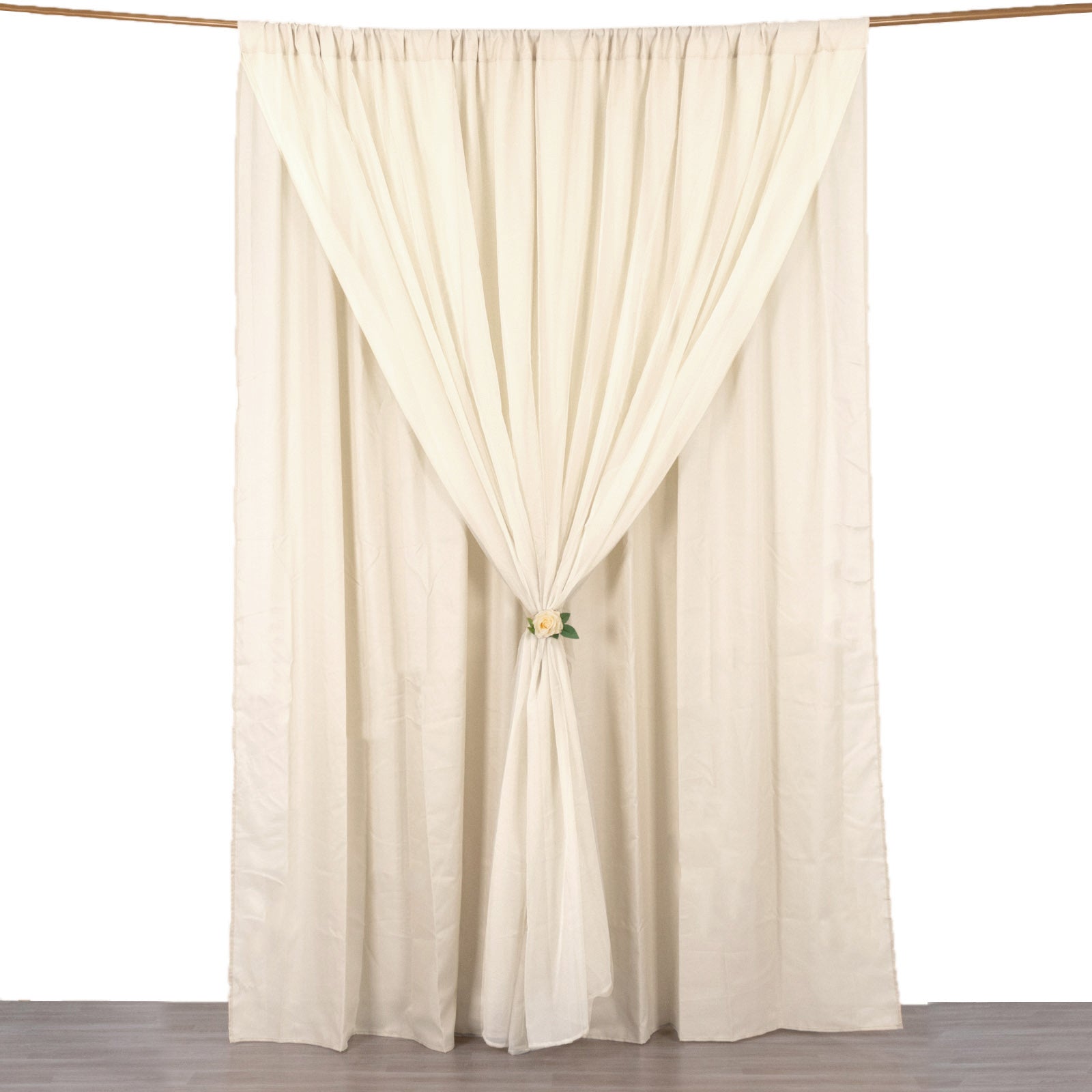 Beige chiffon polyester event curtain drapes with rod pockets.