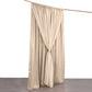 Nude chiffon polyester event curtain drapes on a rod.