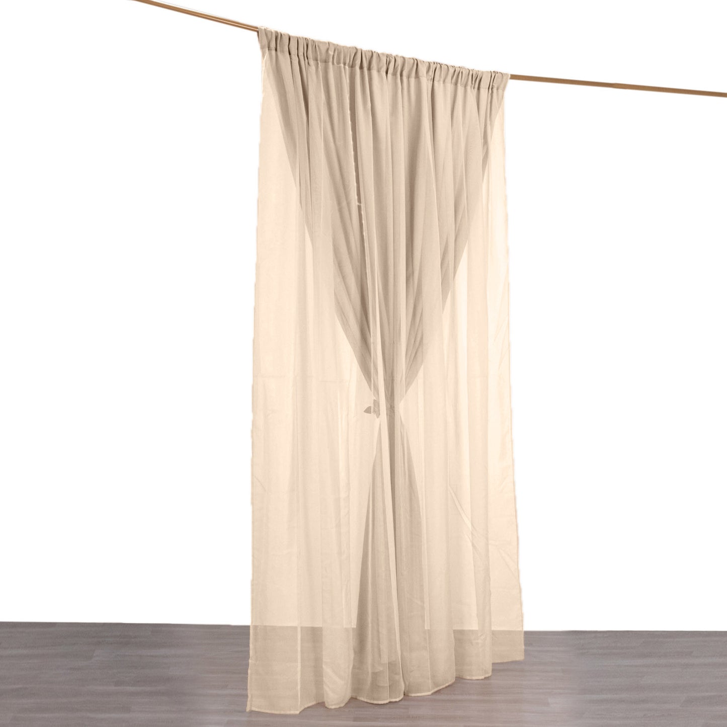 Nude chiffon polyester event curtain drapes hanging elegantly.