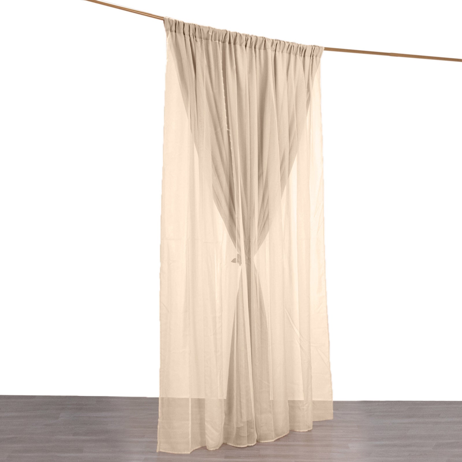 Nude chiffon polyester event curtain drapes hanging elegantly.
