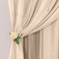 Nude chiffon polyester event curtain drapes with rod pockets.