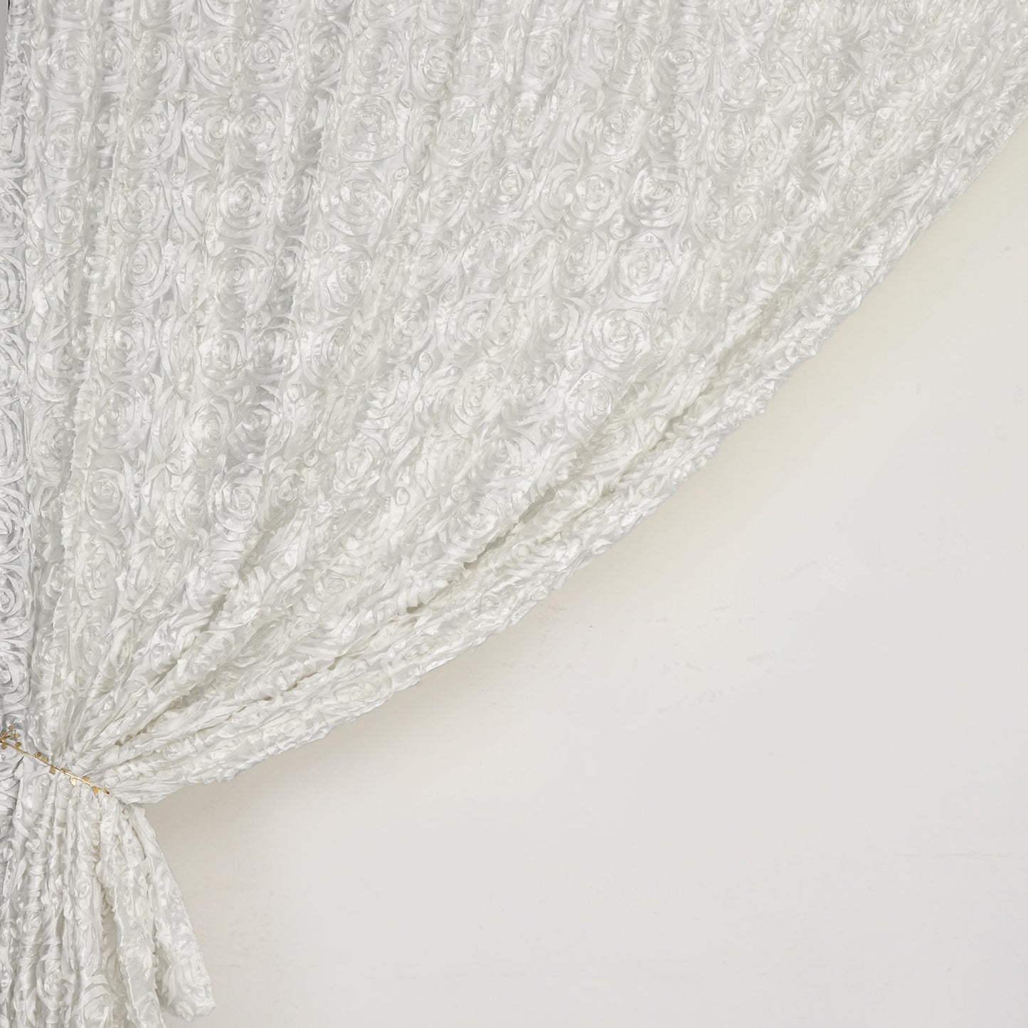 Ivory satin rosette event curtain drapes, perfect for elegant backdrops.