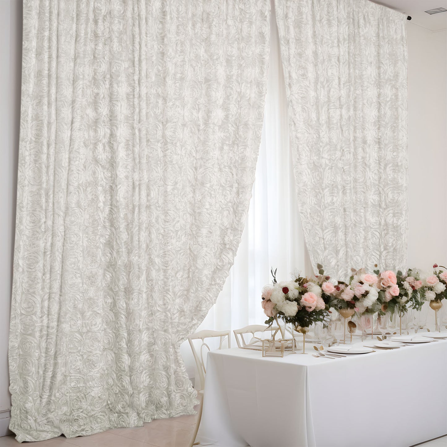 Ivory satin rosette event curtain drapes for elegant backdrops.