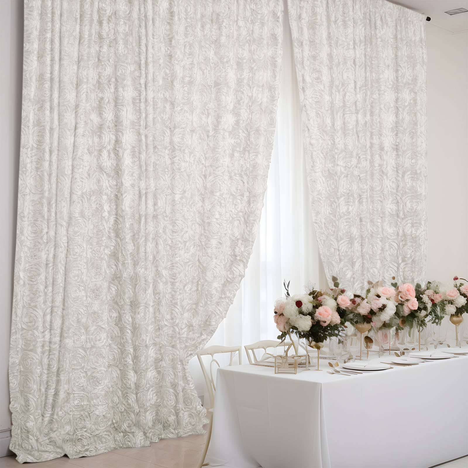 Ivory satin rosette event curtain drapes for elegant backdrops.