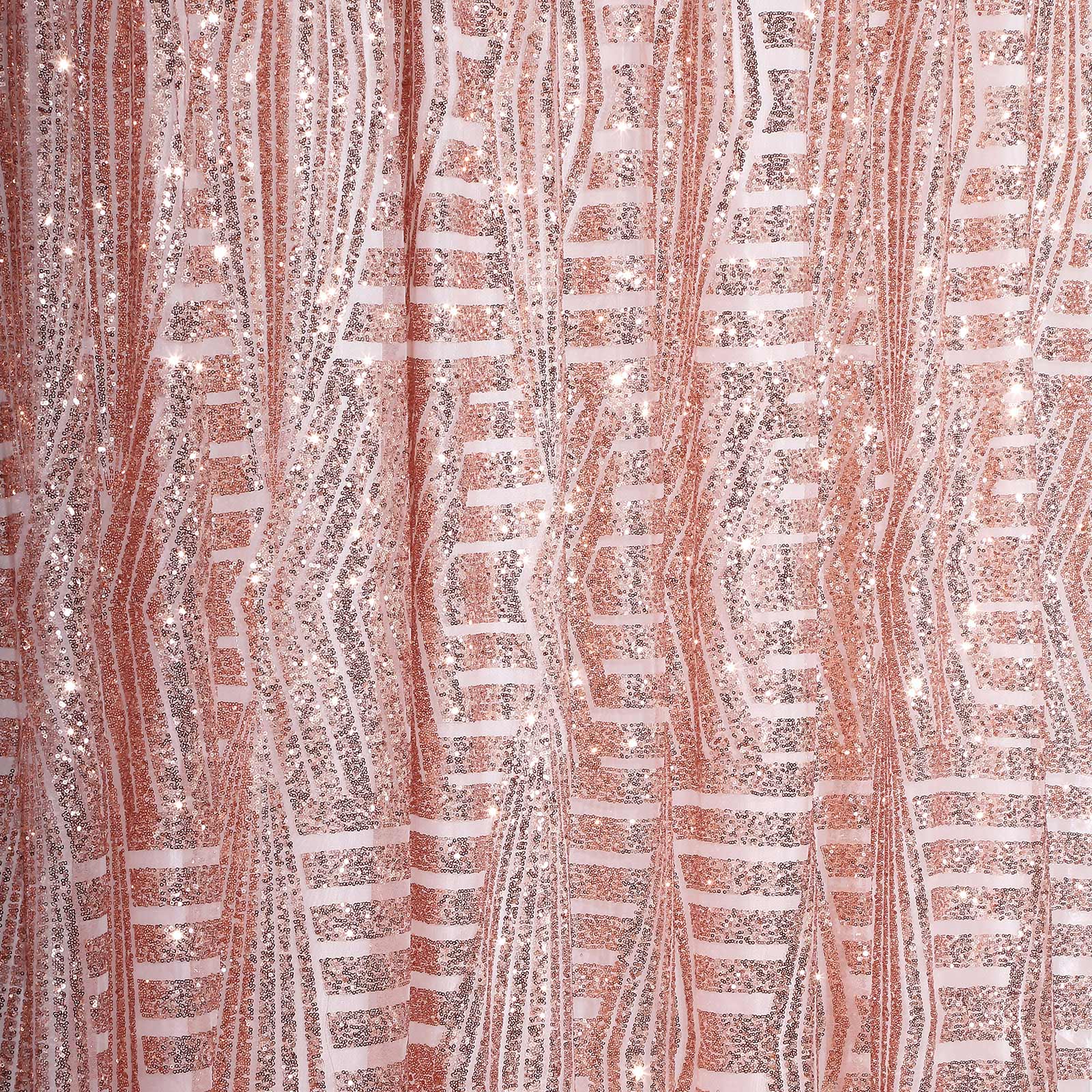 Rose gold geometric sequin curtain drapes with satin backing, sparkly backdrop.