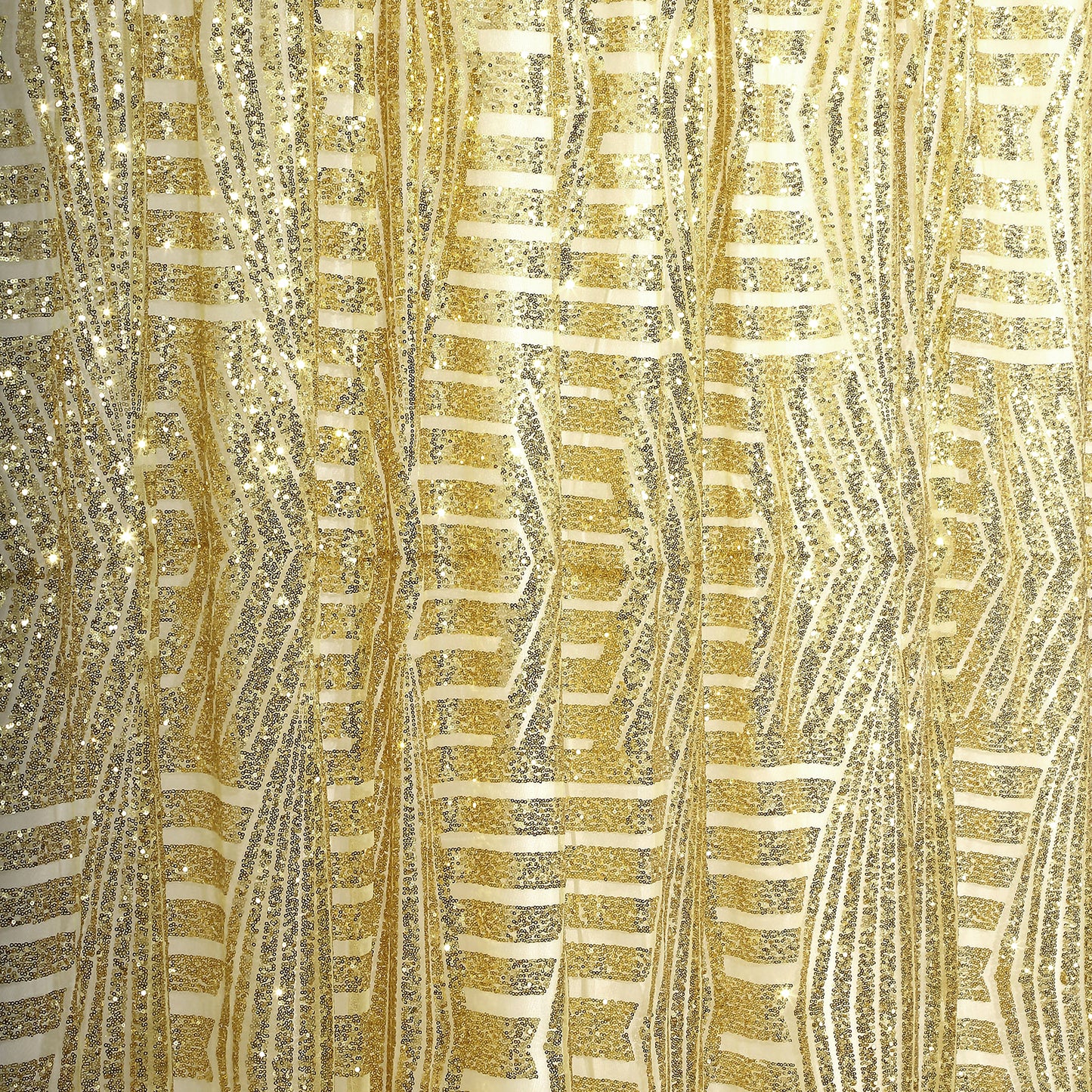 Gold geometric sequin backdrop with satin backing and diamond glitz pattern.