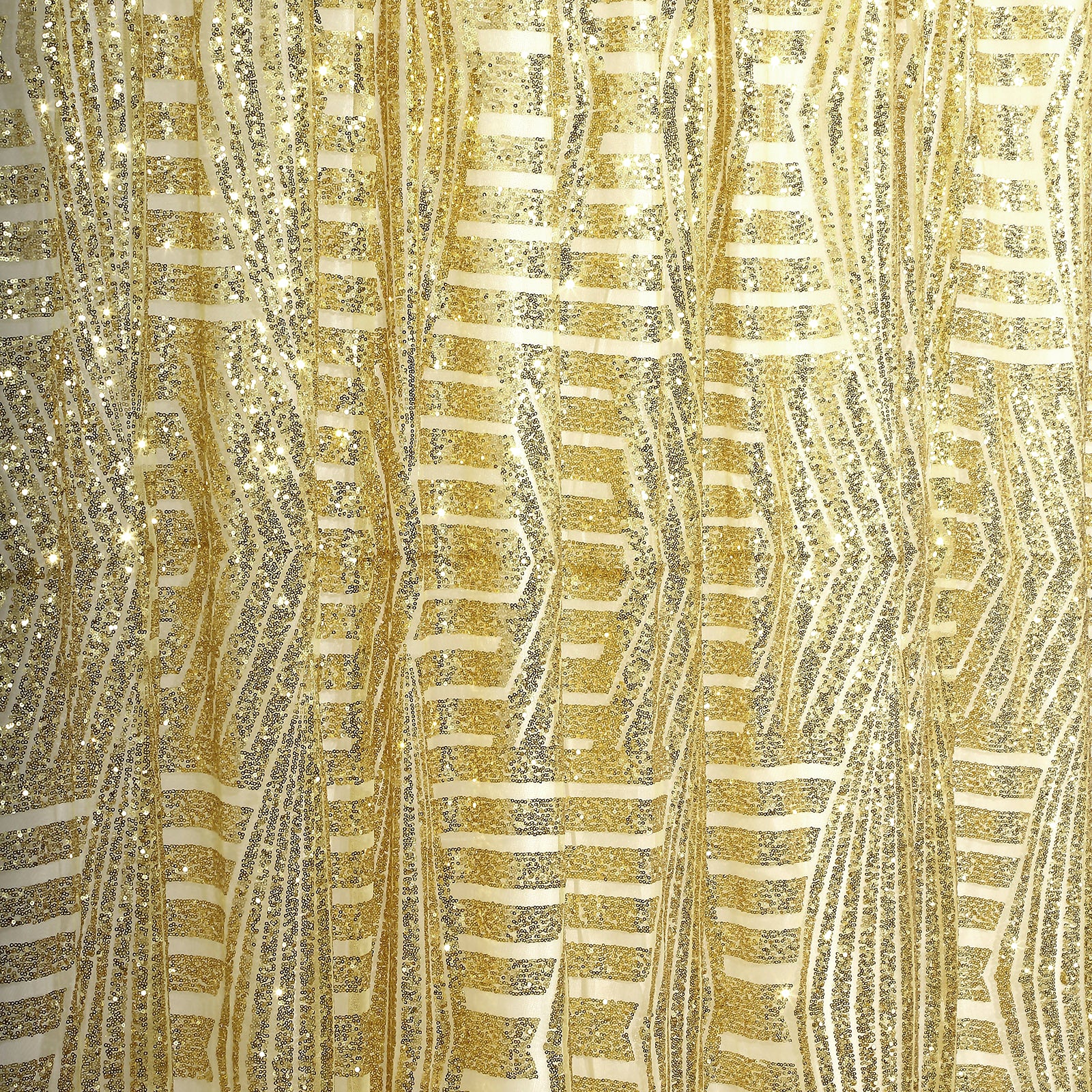 Gold geometric sequin backdrop with satin backing and diamond glitz pattern.