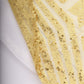 Gold geometric sequin curtain drapes with satin backing in diamond glitz pattern.