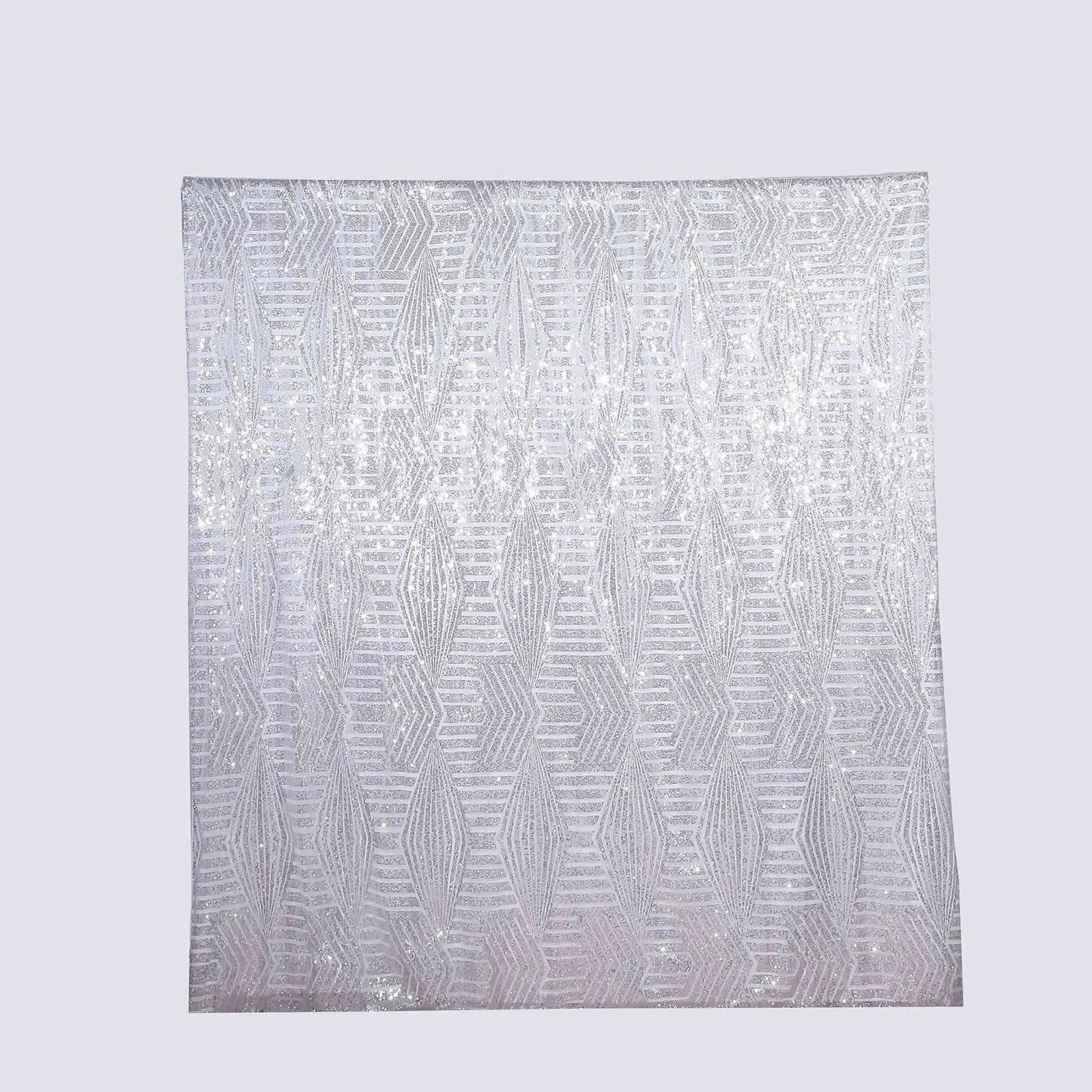 Silver geometric sequin event curtain drapes with satin backing.
