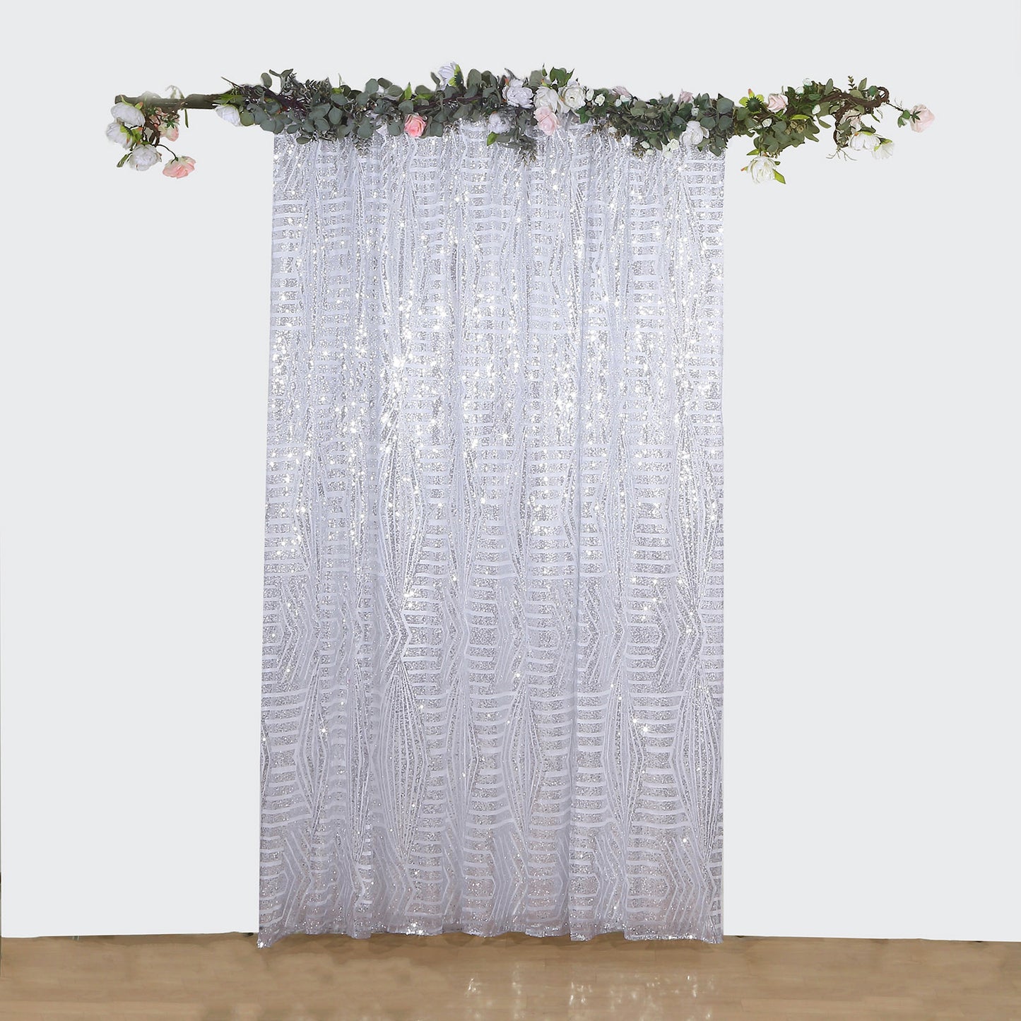 Silver geometric sequin backdrop curtain drapes with satin backing.
