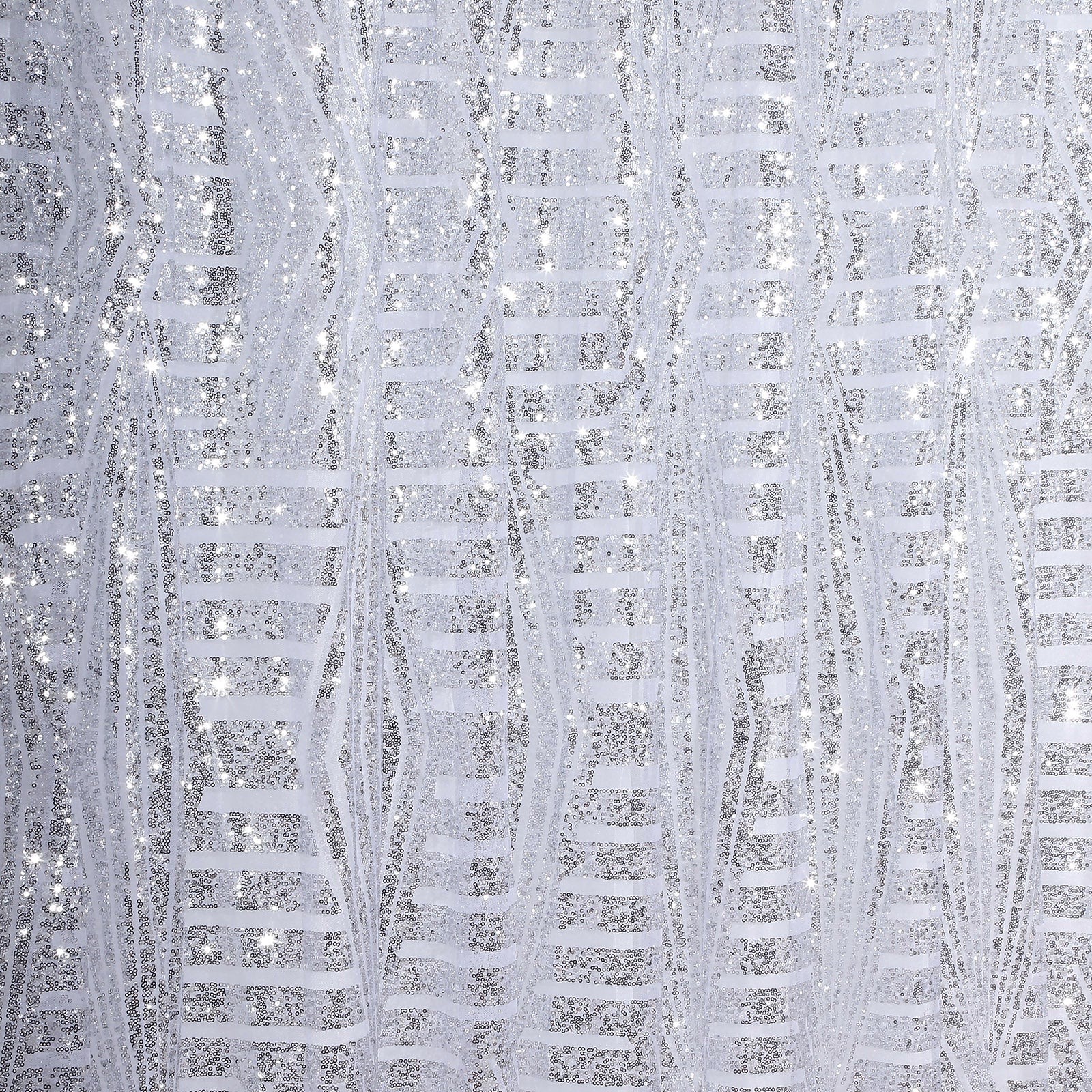 Silver geometric sequin event curtain drapes with satin backing.