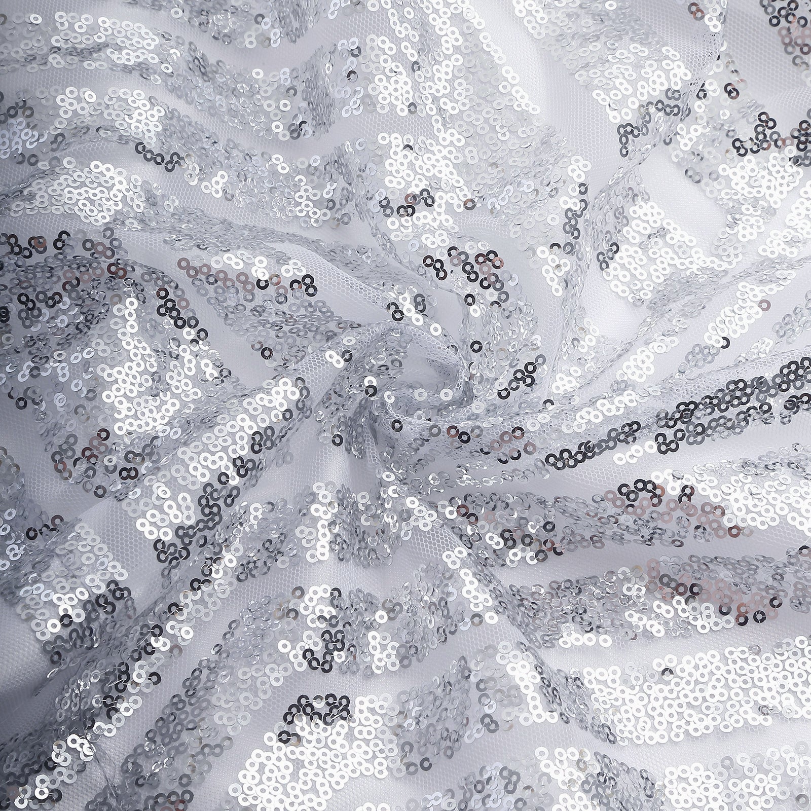 Silver geometric sequin event curtain drapes with satin backing.