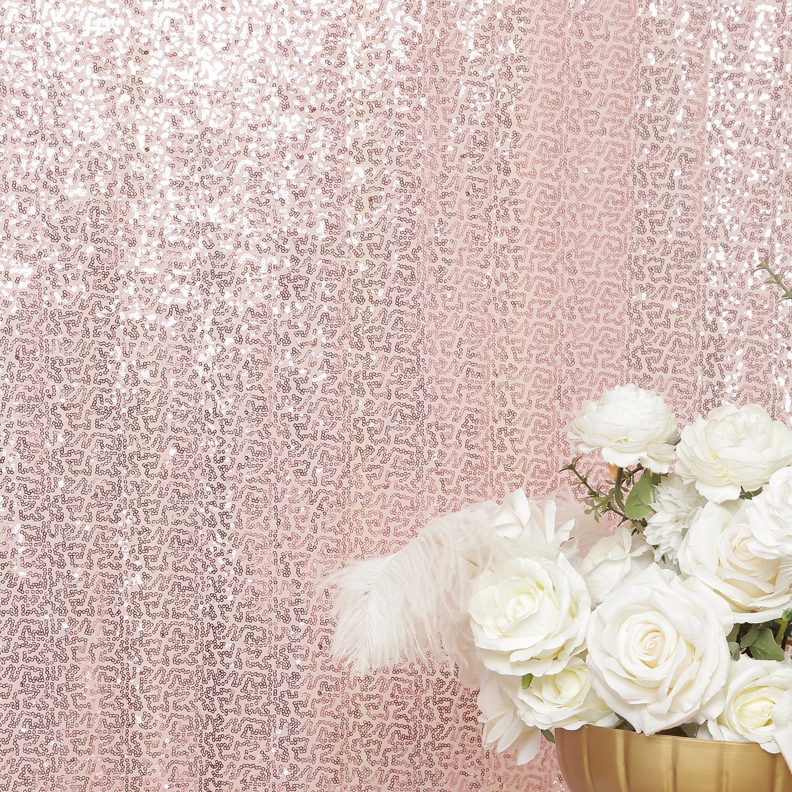 Pink sequin backdrop curtain with shimmering drape panel for events.