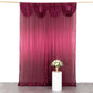 Burgundy pleated satin event curtain drape backdrop with glossy finish.