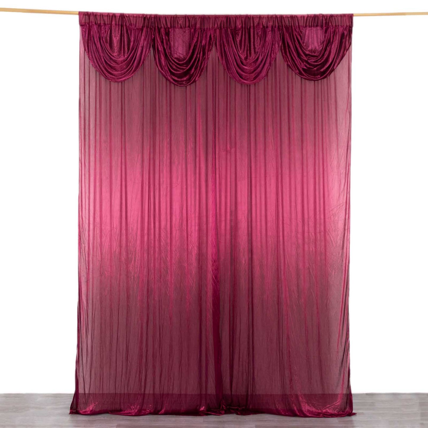 Burgundy pleated satin event curtain drapes for glossy photo backdrop.