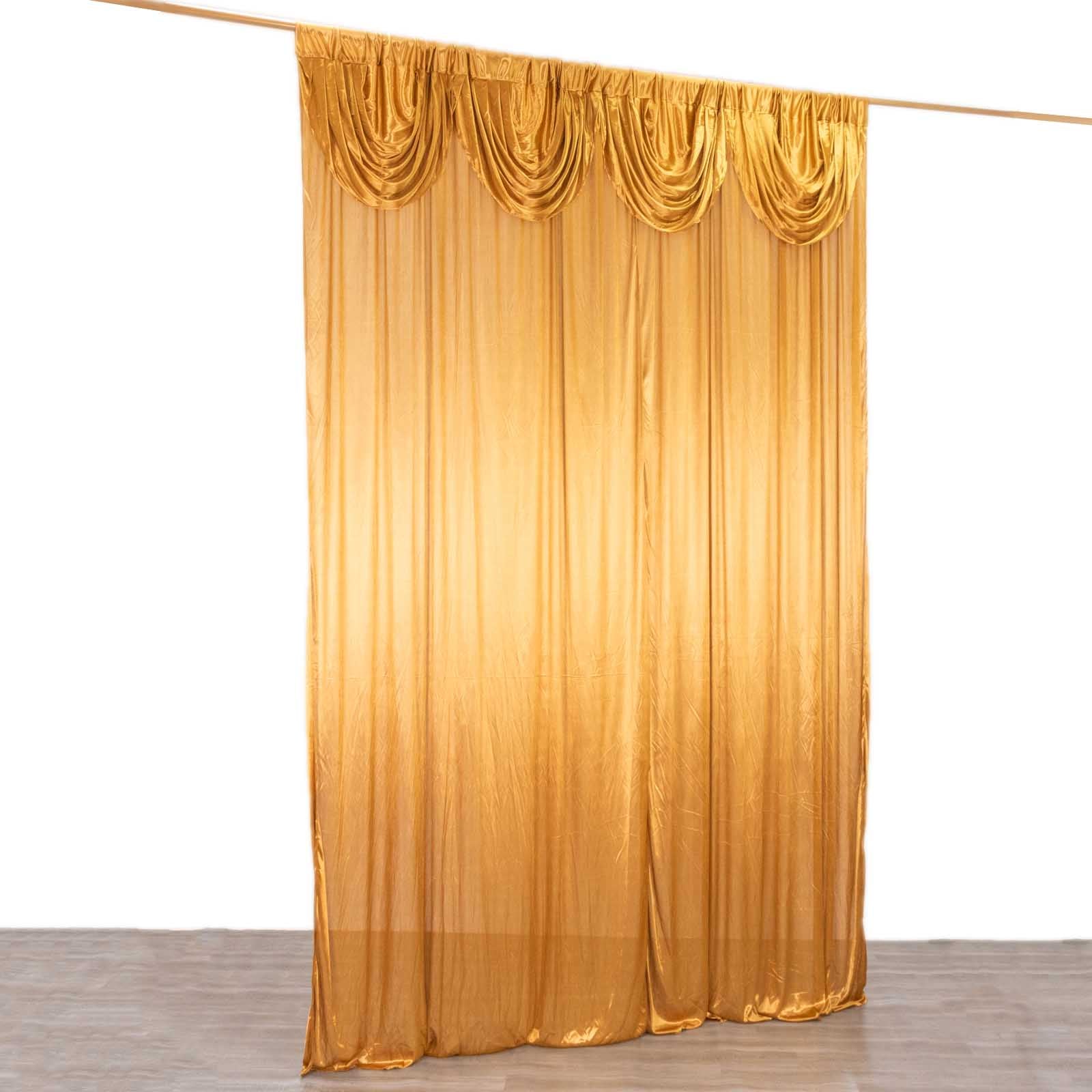 Gold satin pleated event curtain drapes for glamorous photo backdrops.