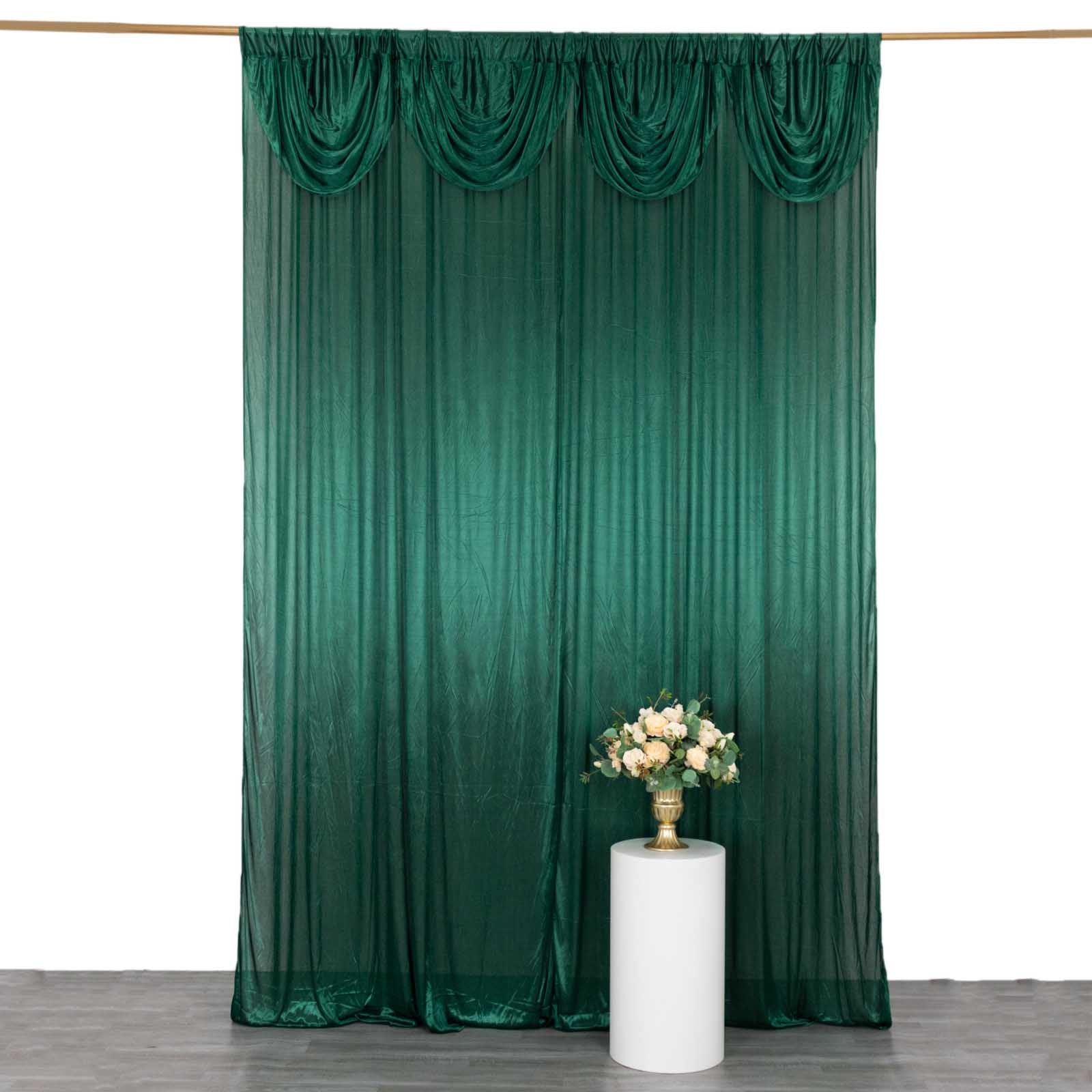 Emerald green pleated satin event curtain drapes backdrop.