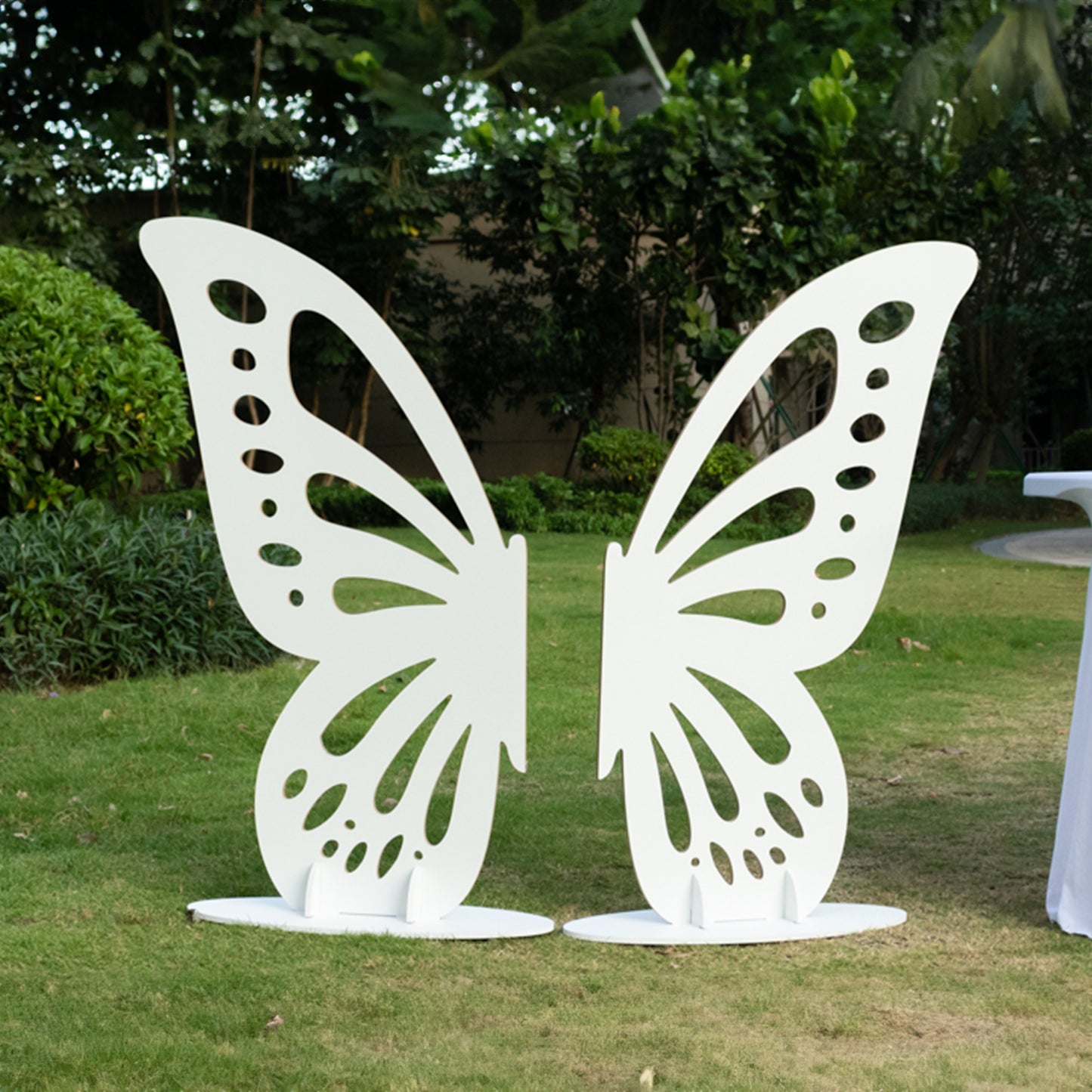 White freestanding wooden butterfly wings backdrop photo prop.