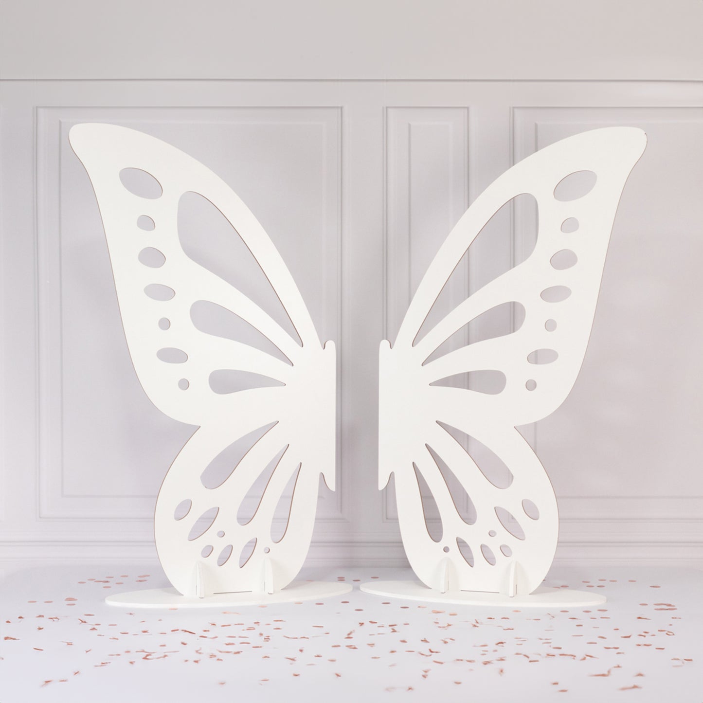 White freestanding wooden butterfly wings backdrop photo prop.