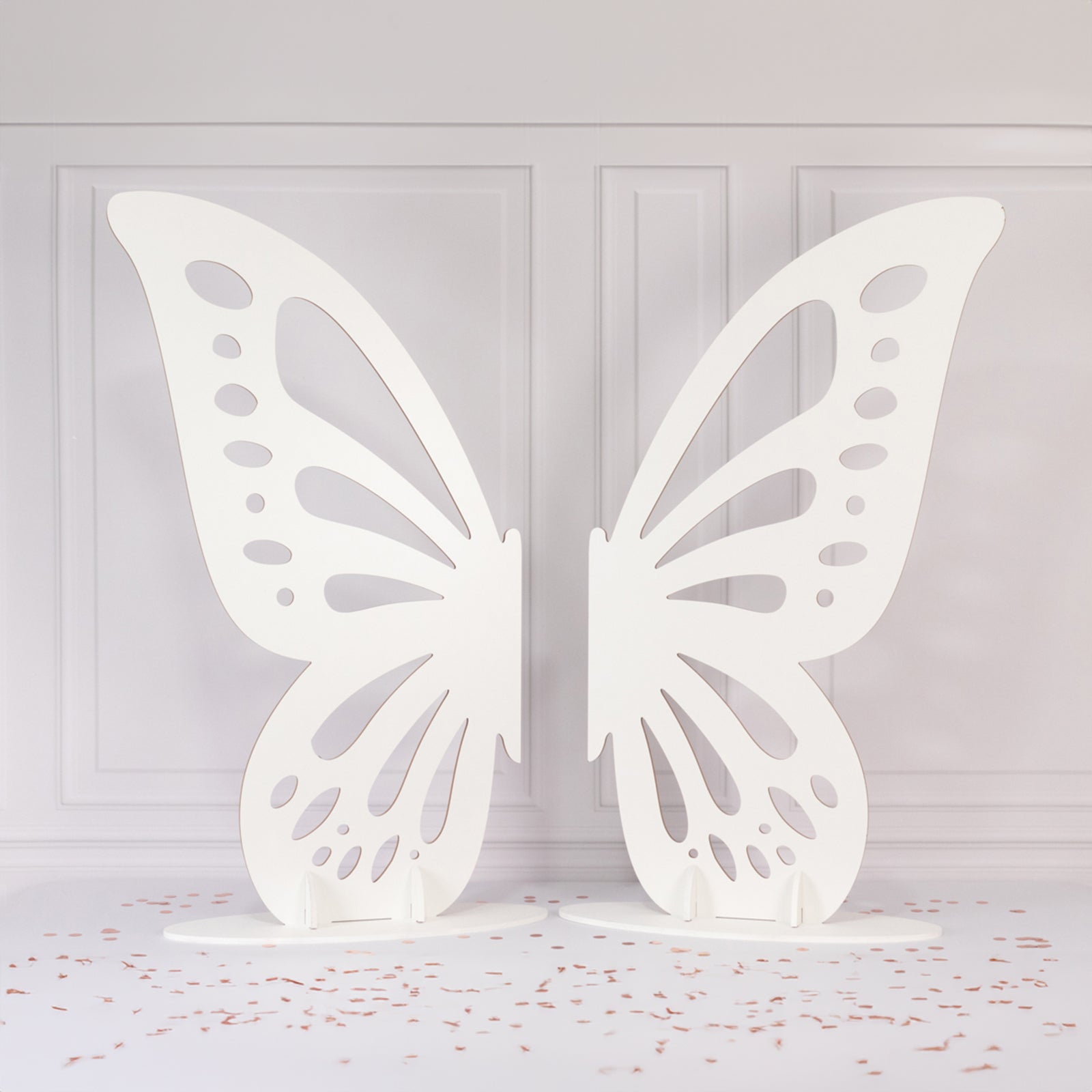 White freestanding wooden butterfly wings backdrop photo prop.